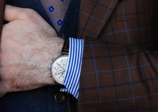 The man has an elegant watch on his hand